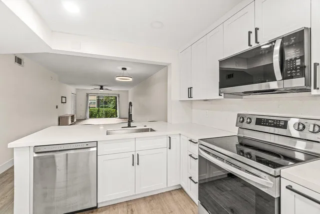 a kitchen with a stove and a microwave
