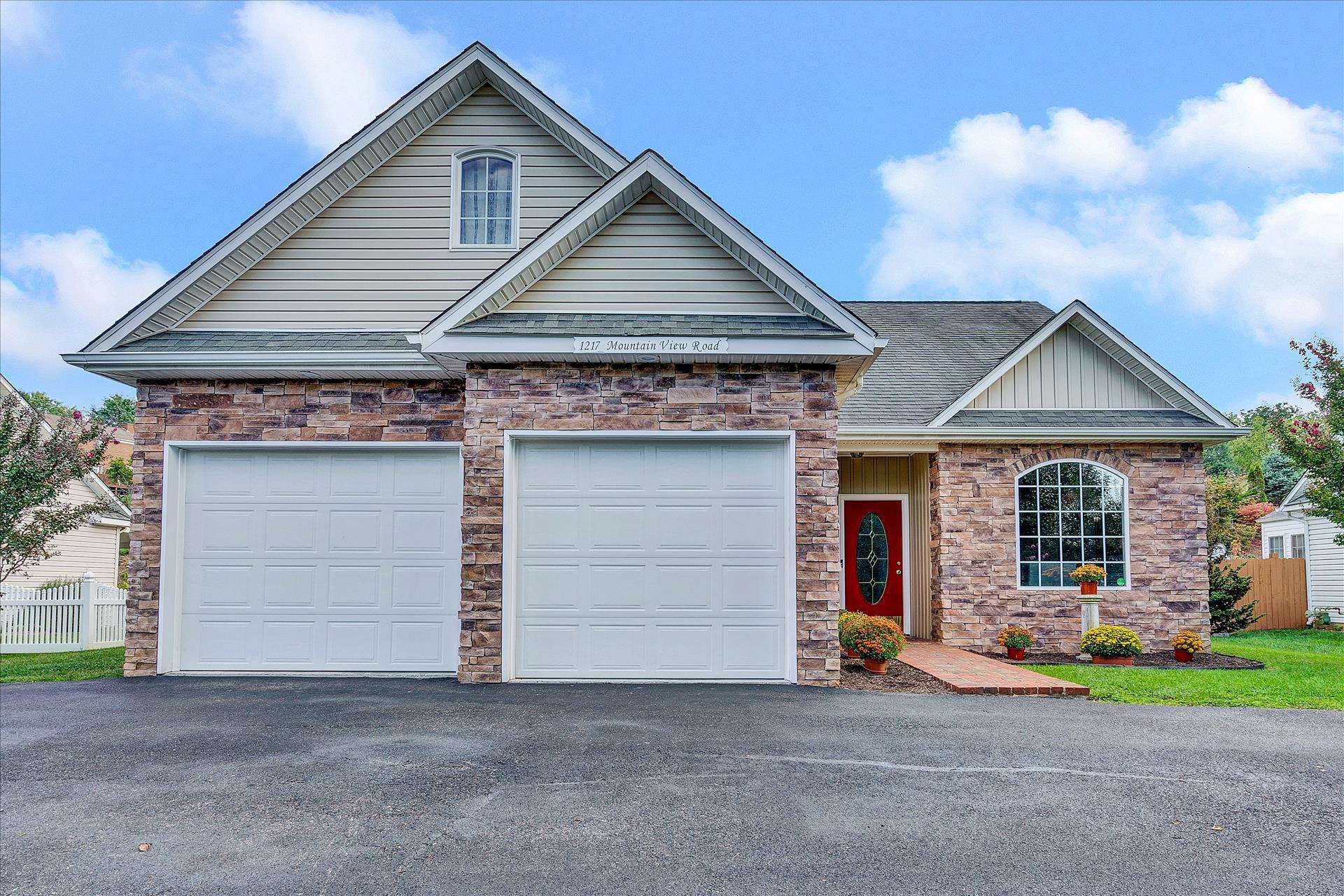a front view of a house with a garage
