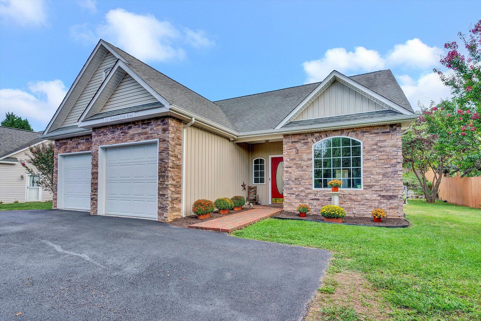 1217 Mountain View Road Vinton, VA 24179 - Photo 2 of 31 a front view of a house with a yard and garage