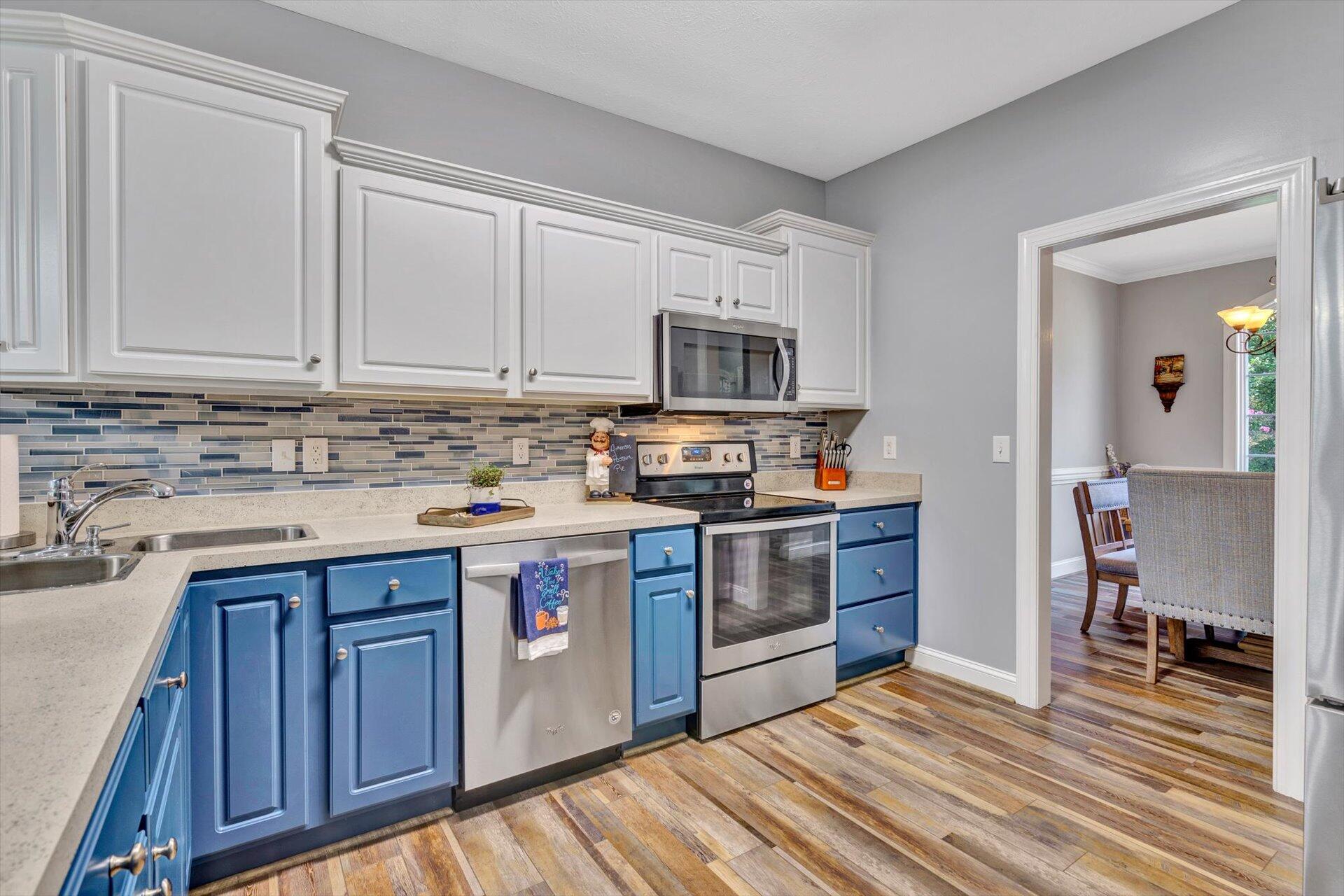 1217 Mountain View Road Vinton, VA 24179 - Photo 12 of 31 a kitchen with stainless steel appliances granite countertop a stove sink and cabinets