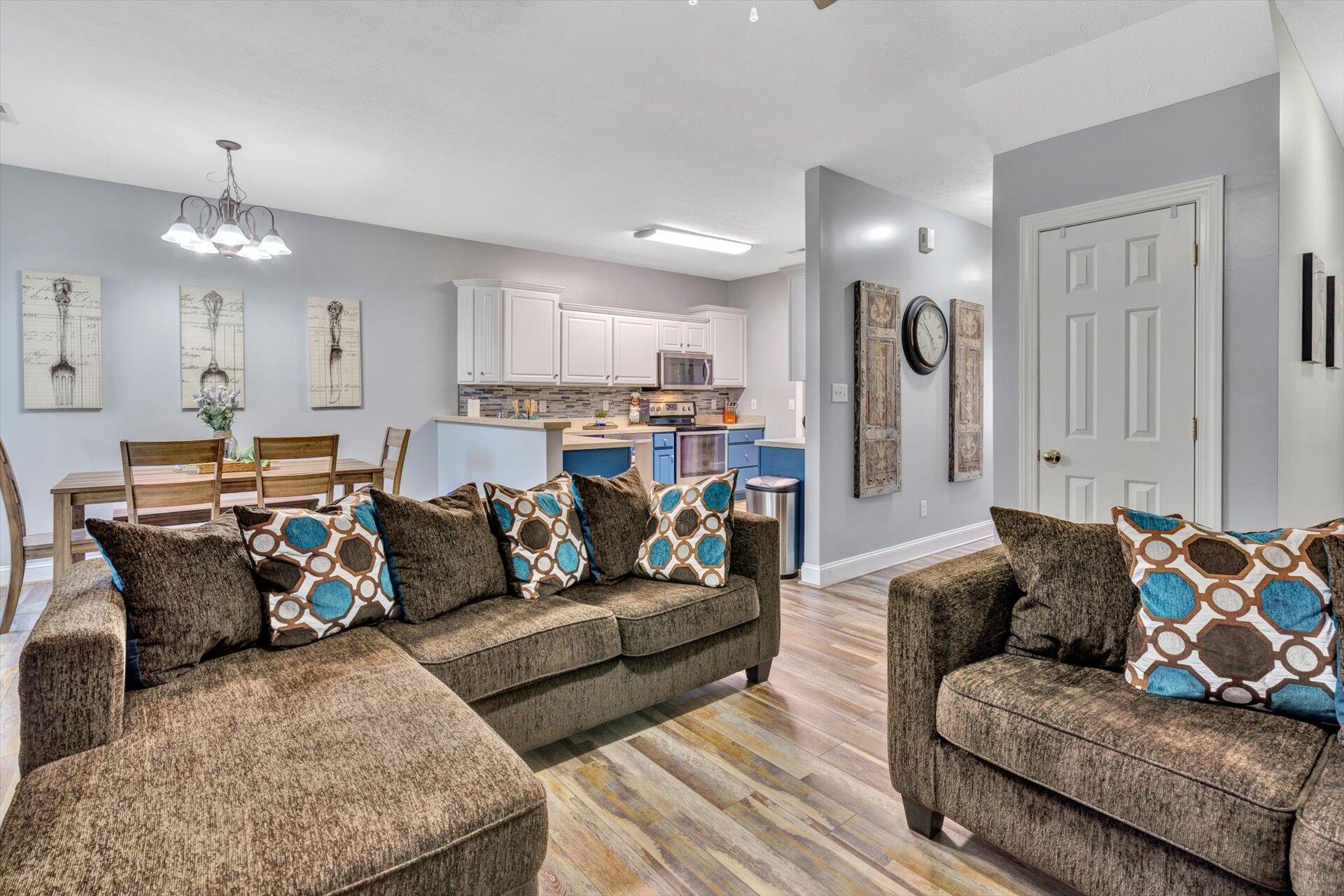 1217 Mountain View Road Vinton, VA 24179 - Photo 15 of 31 a living room with furniture and a chandelier