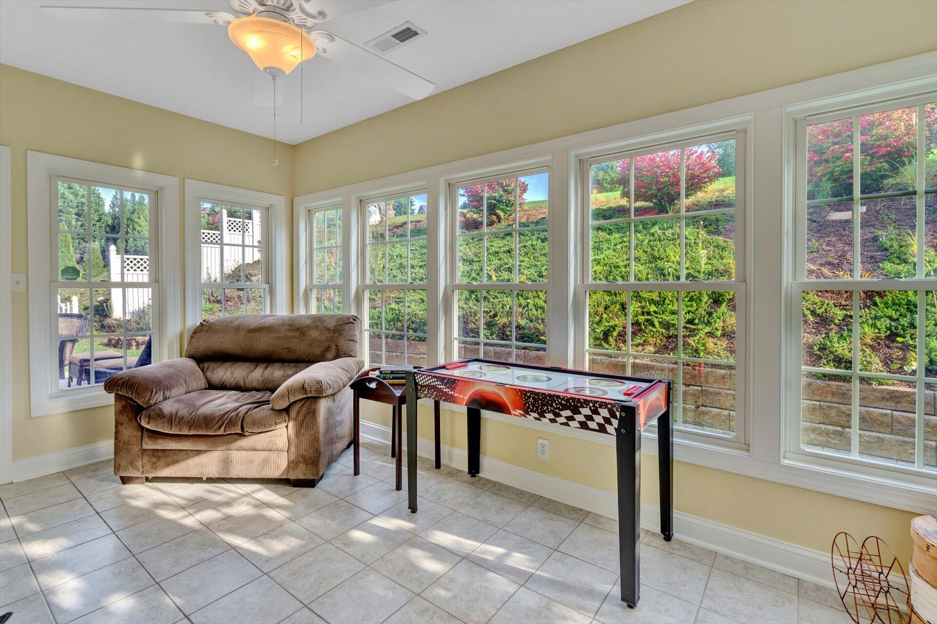 1217 Mountain View Road Vinton, VA 24179 - Photo 16 of 31 a living room with furniture and a floor to ceiling window