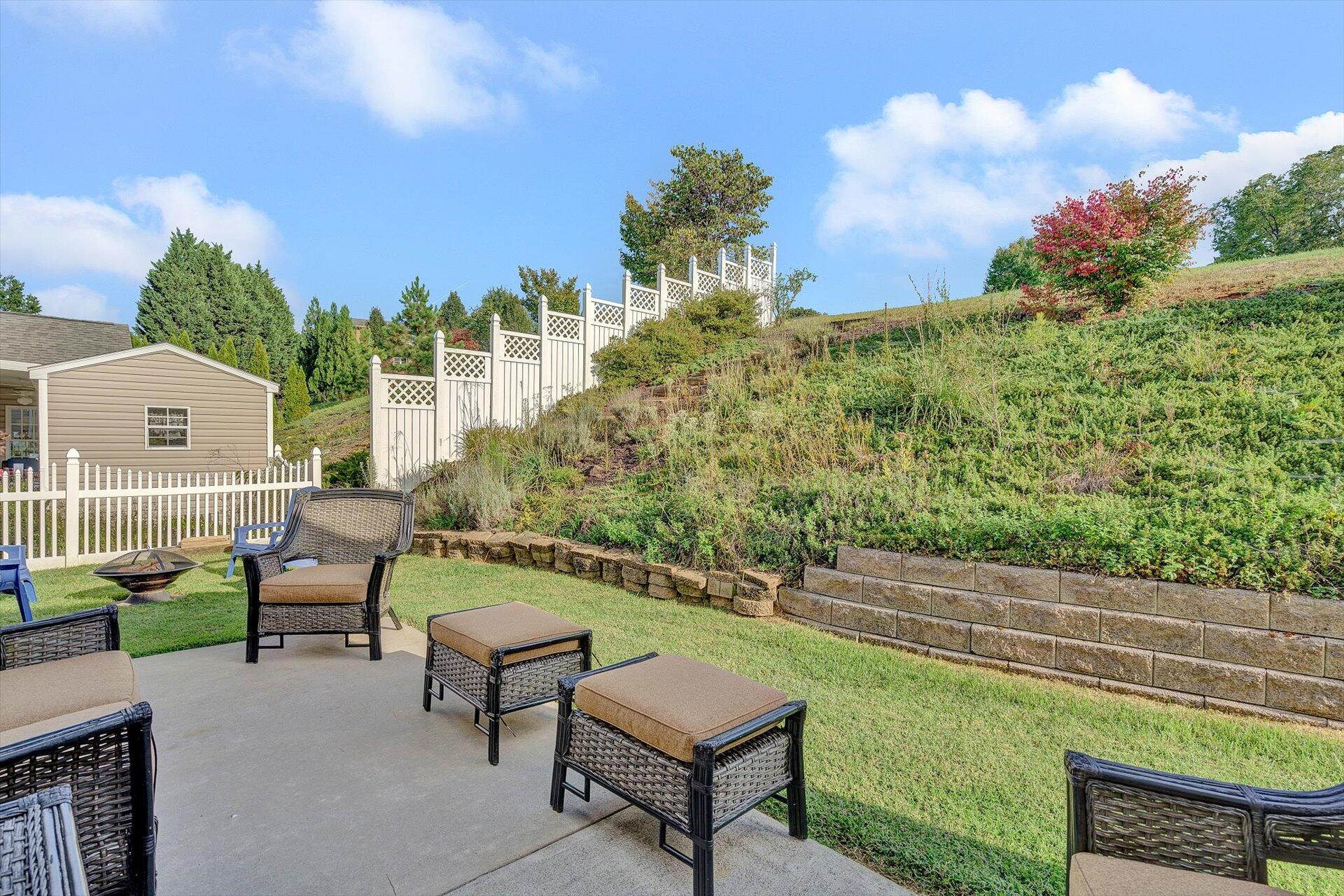 1217 Mountain View Road Vinton, VA 24179 - Photo 18 of 31 a view of a backyard with plants and a patio