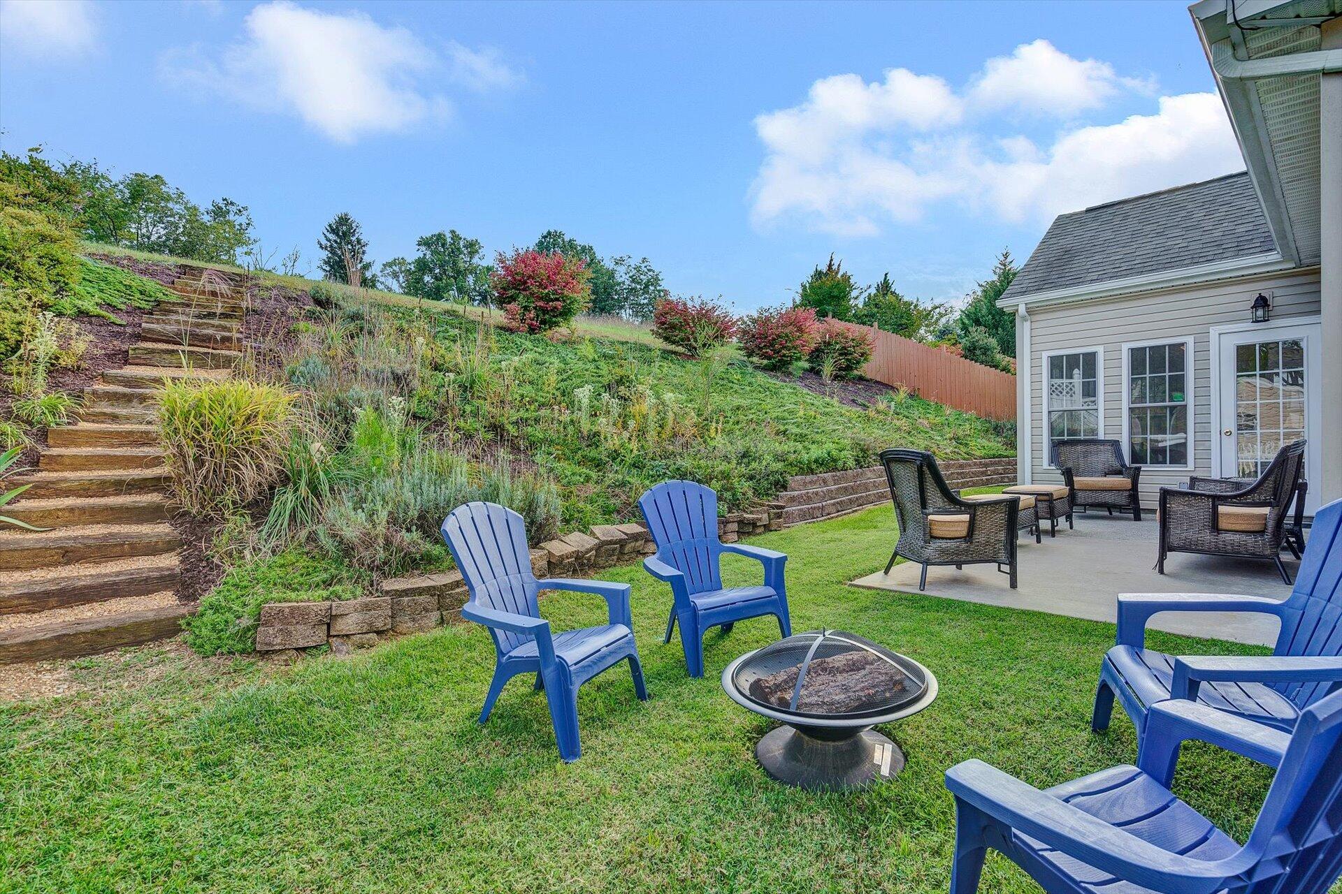 1217 Mountain View Road Vinton, VA 24179 - Photo 19 of 31 a view of a backyard with plants and a patio