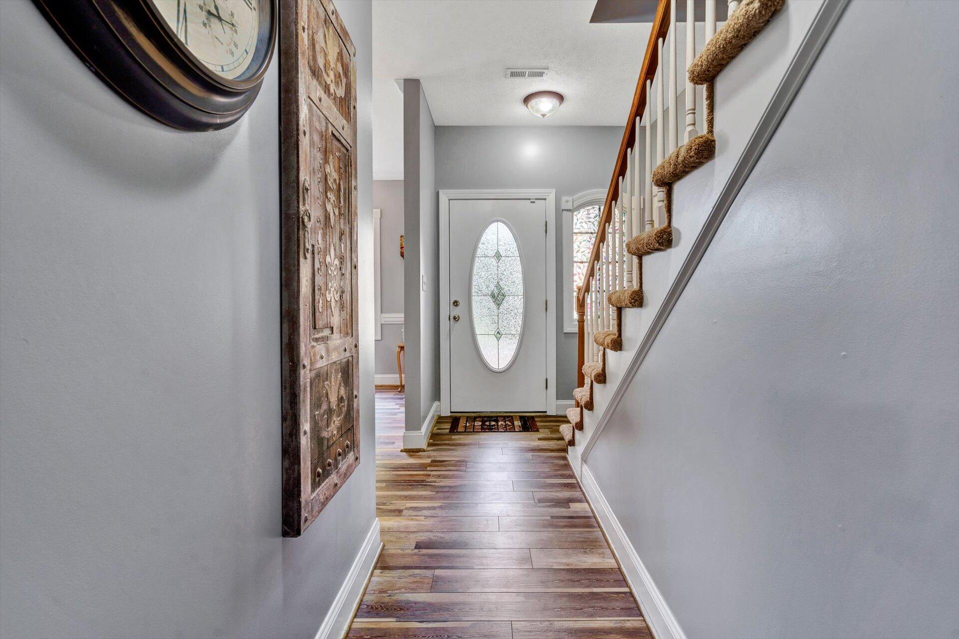 1217 Mountain View Road Vinton, VA 24179 - Photo 8 of 31 a view of a hallway with wooden floor and staircase