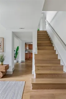 a view of entryway and hall with wooden floor