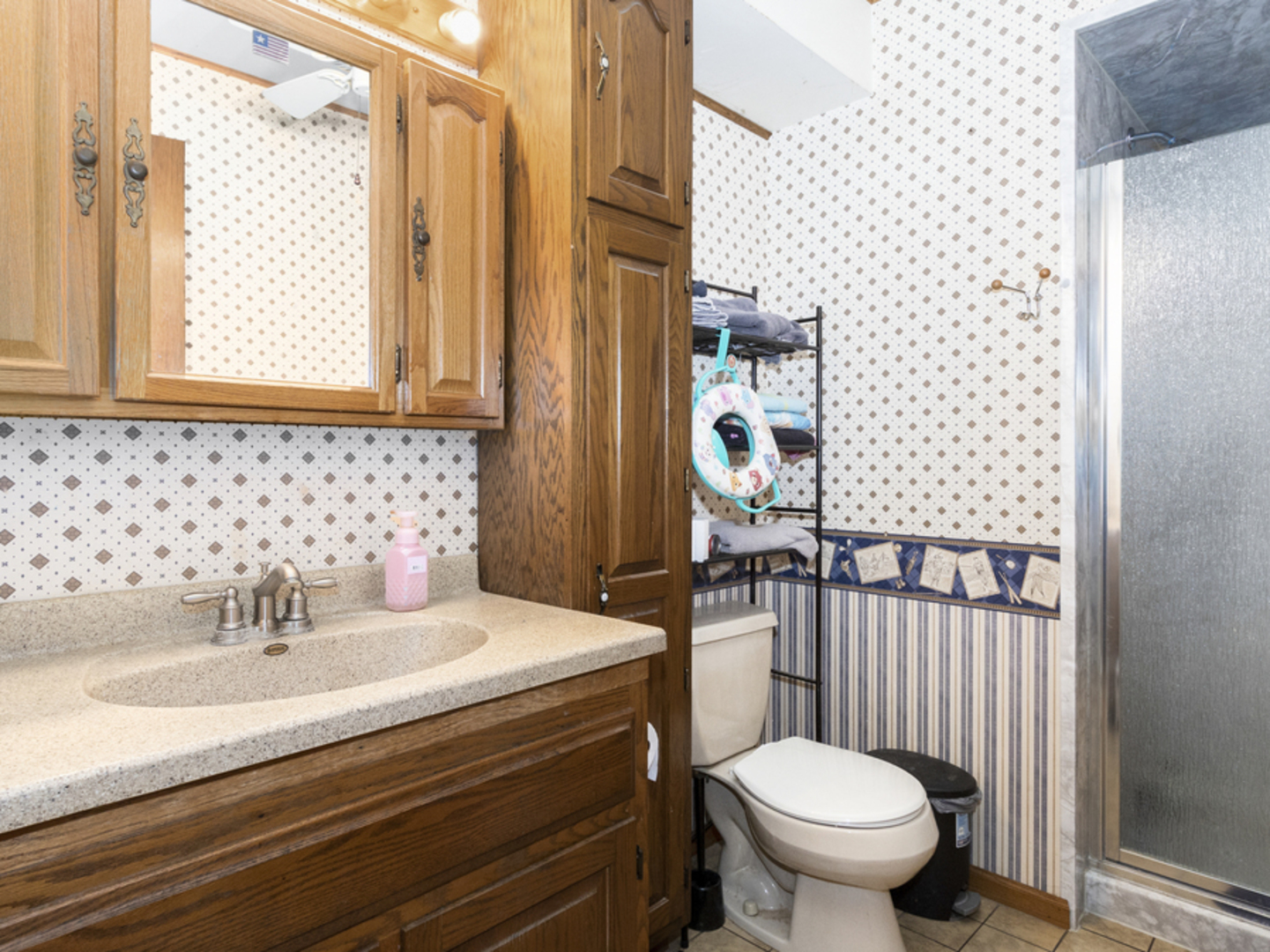 17555 West Spangler Road Elwood, IL 60421 - Photo 10 of 29 a bathroom with a sink toilet and shower