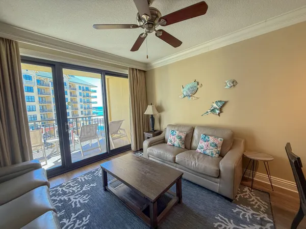 a living room with furniture and a rug