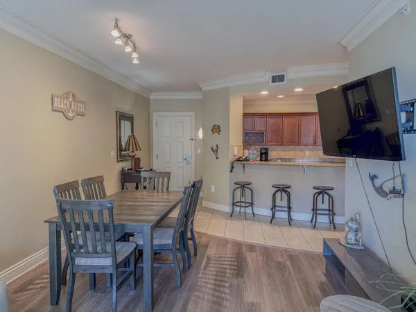 a view of a dining room with furniture and wooden floor