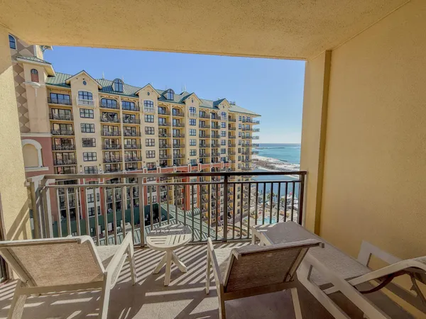 a view of a balcony with chairs