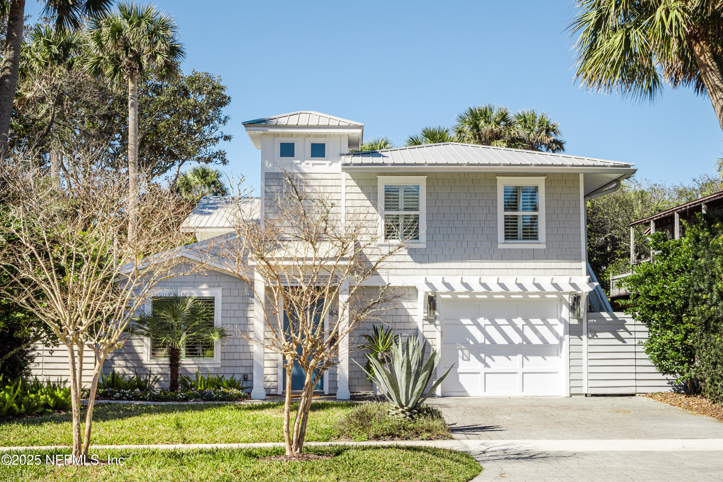 440 Ocean Boulevard Atlantic Beach, FL 32233 - Photo 1 of 34 a front view of a house with a yard