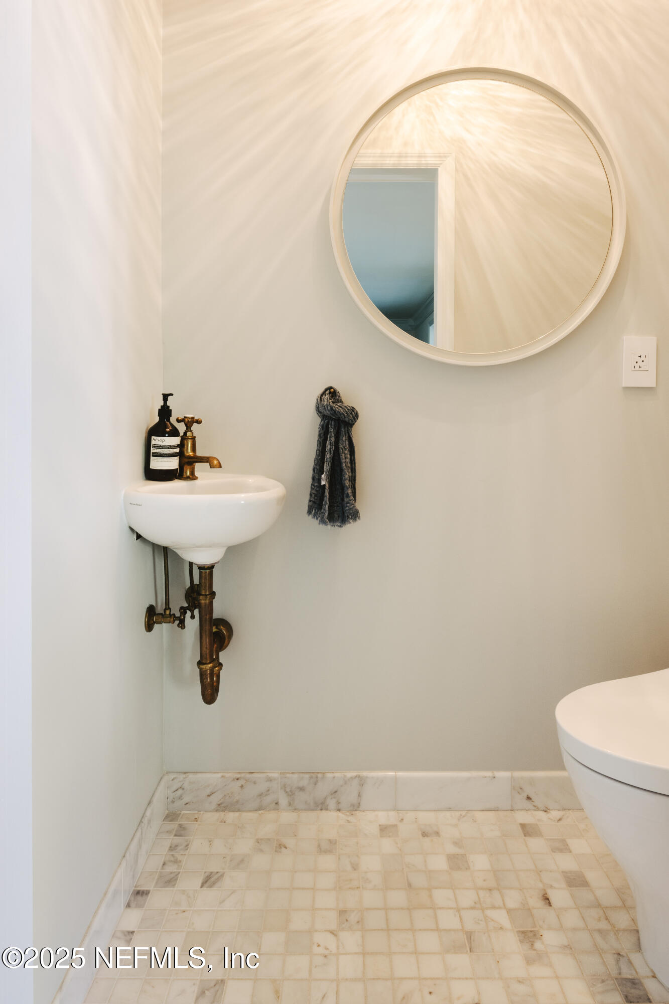 440 Ocean Boulevard Atlantic Beach, FL 32233 - Photo 13 of 34 a bathroom with a sink and mirror