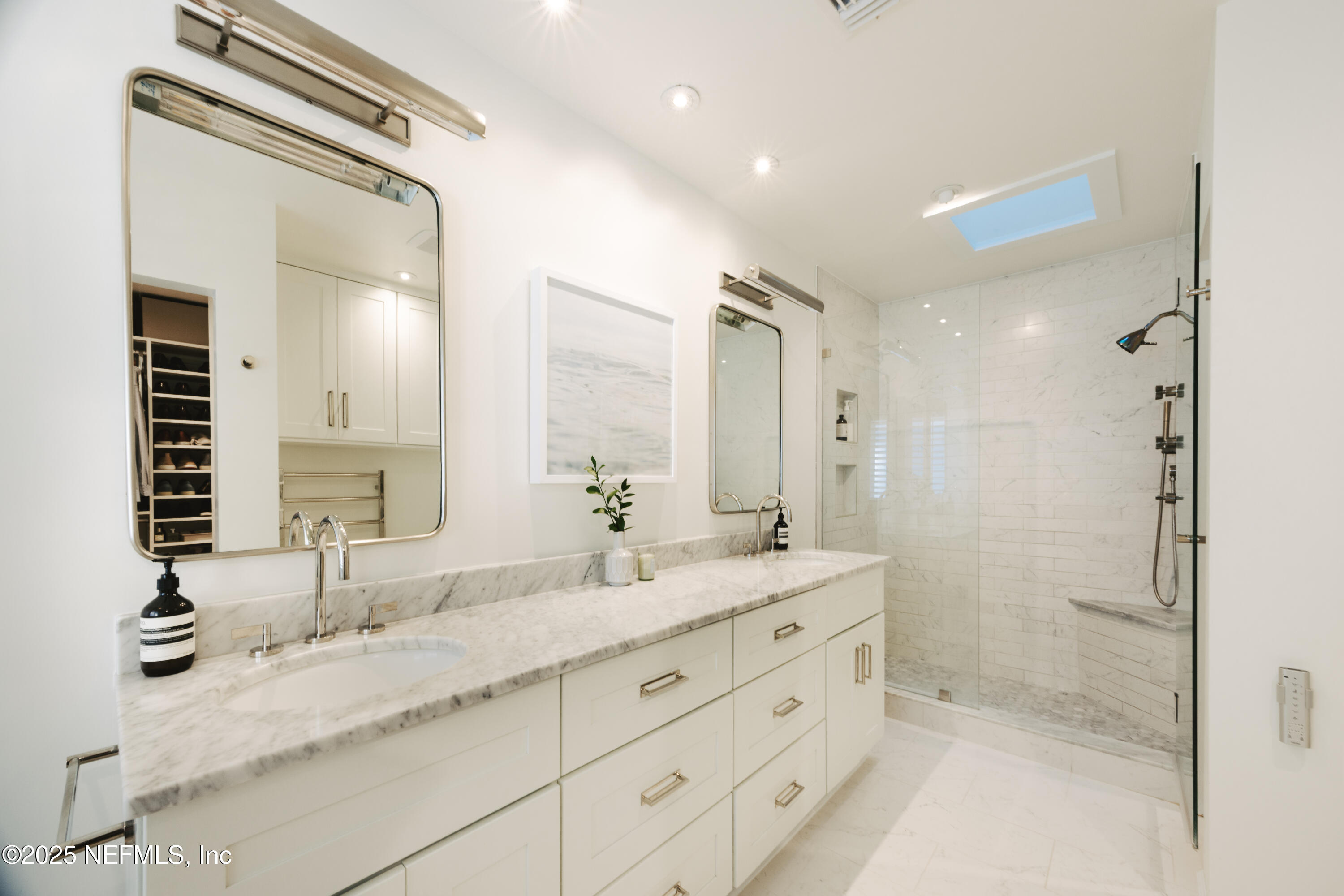 440 Ocean Boulevard Atlantic Beach, FL 32233 - Photo 19 of 34 a bathroom with double sink and a mirror