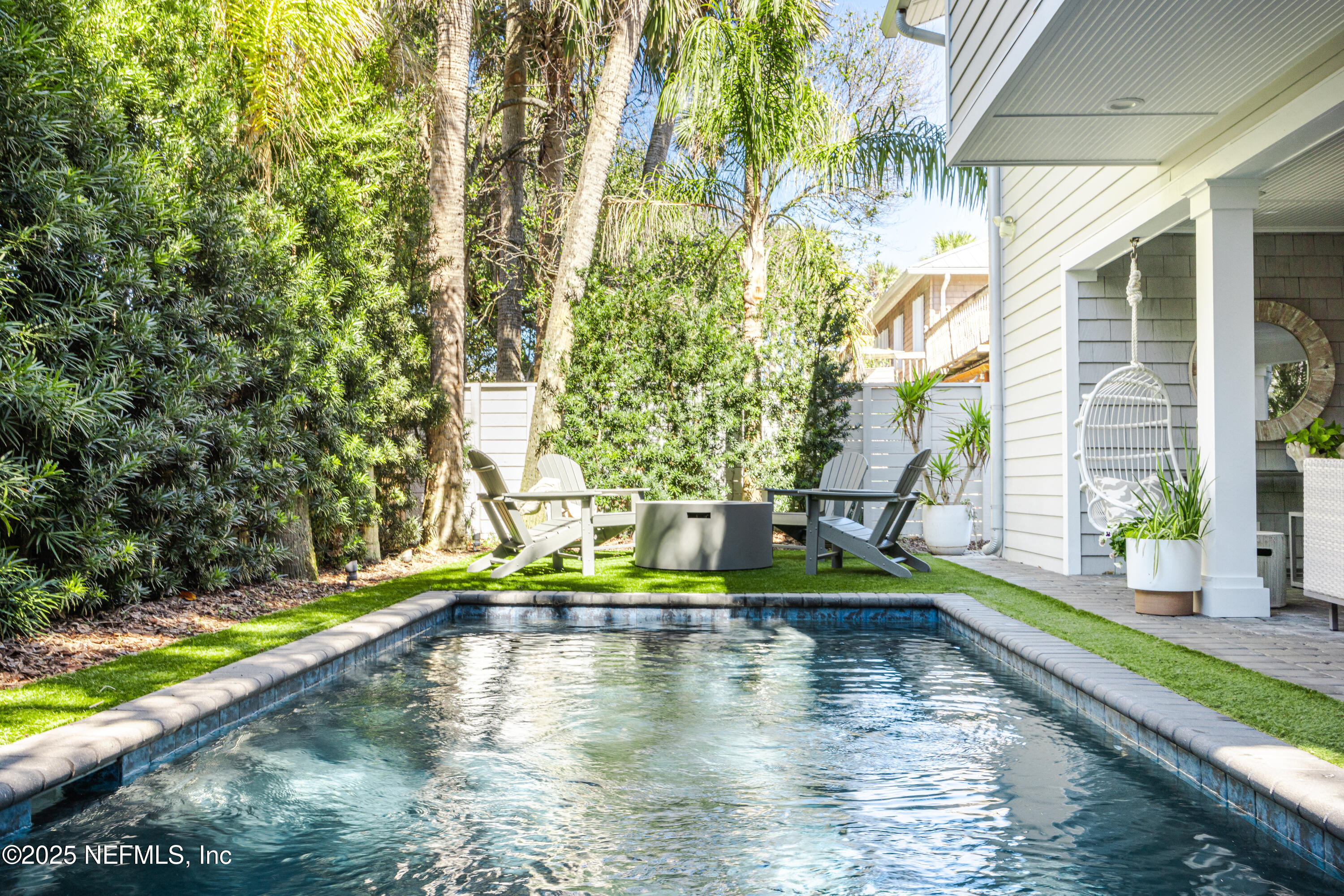 440 Ocean Boulevard Atlantic Beach, FL 32233 - Photo 28 of 34 a view of swimming pool with a yard