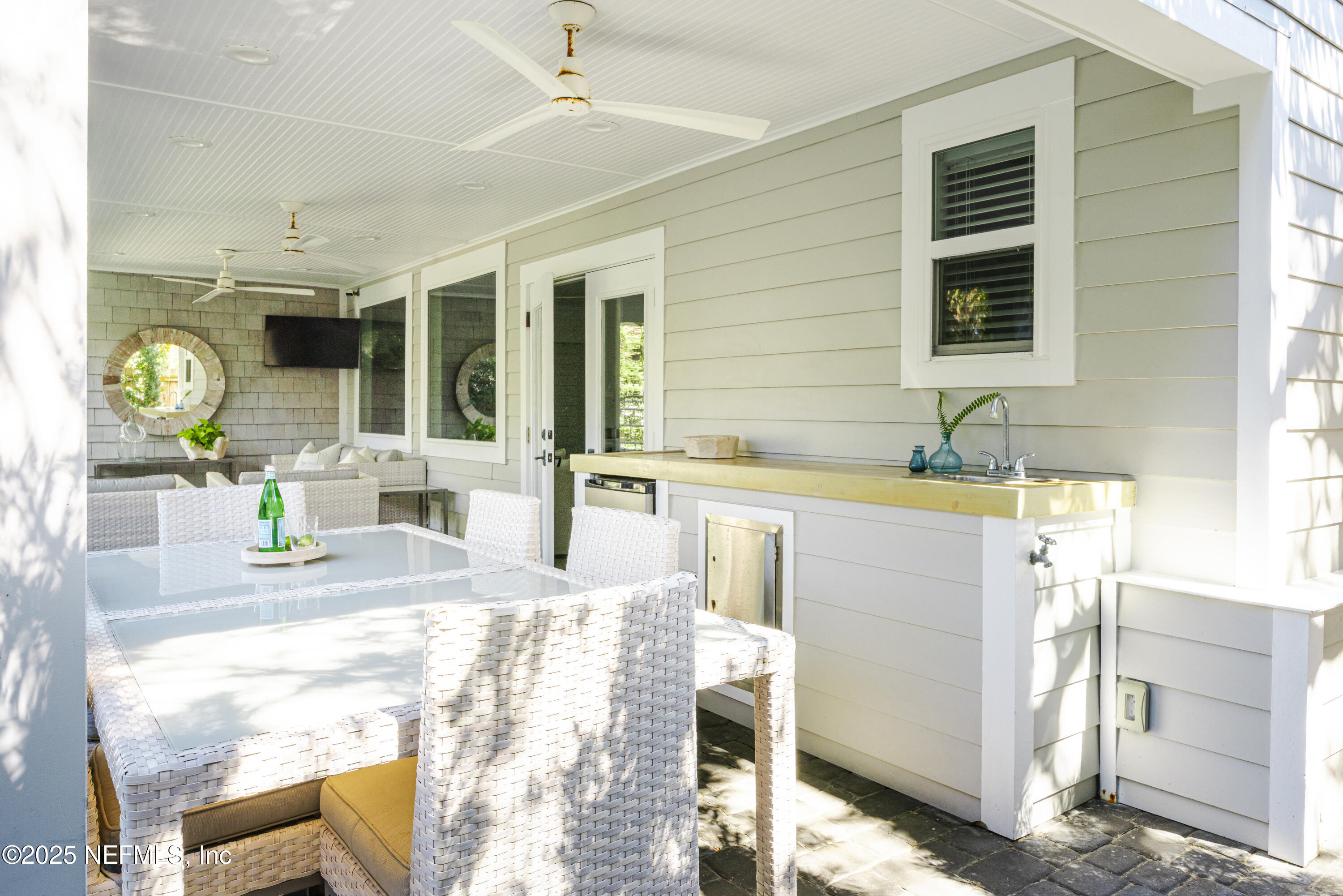 440 Ocean Boulevard Atlantic Beach, FL 32233 - Photo 29 of 34 a bathroom with a granite countertop sink and a mirror