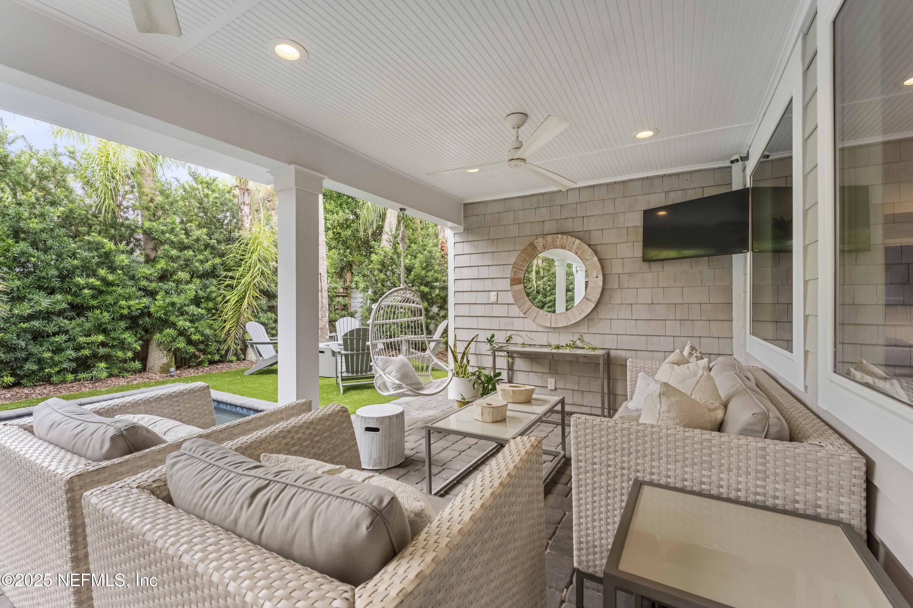 440 Ocean Boulevard Atlantic Beach, FL 32233 - Photo 30 of 34 a living room with furniture and a large window