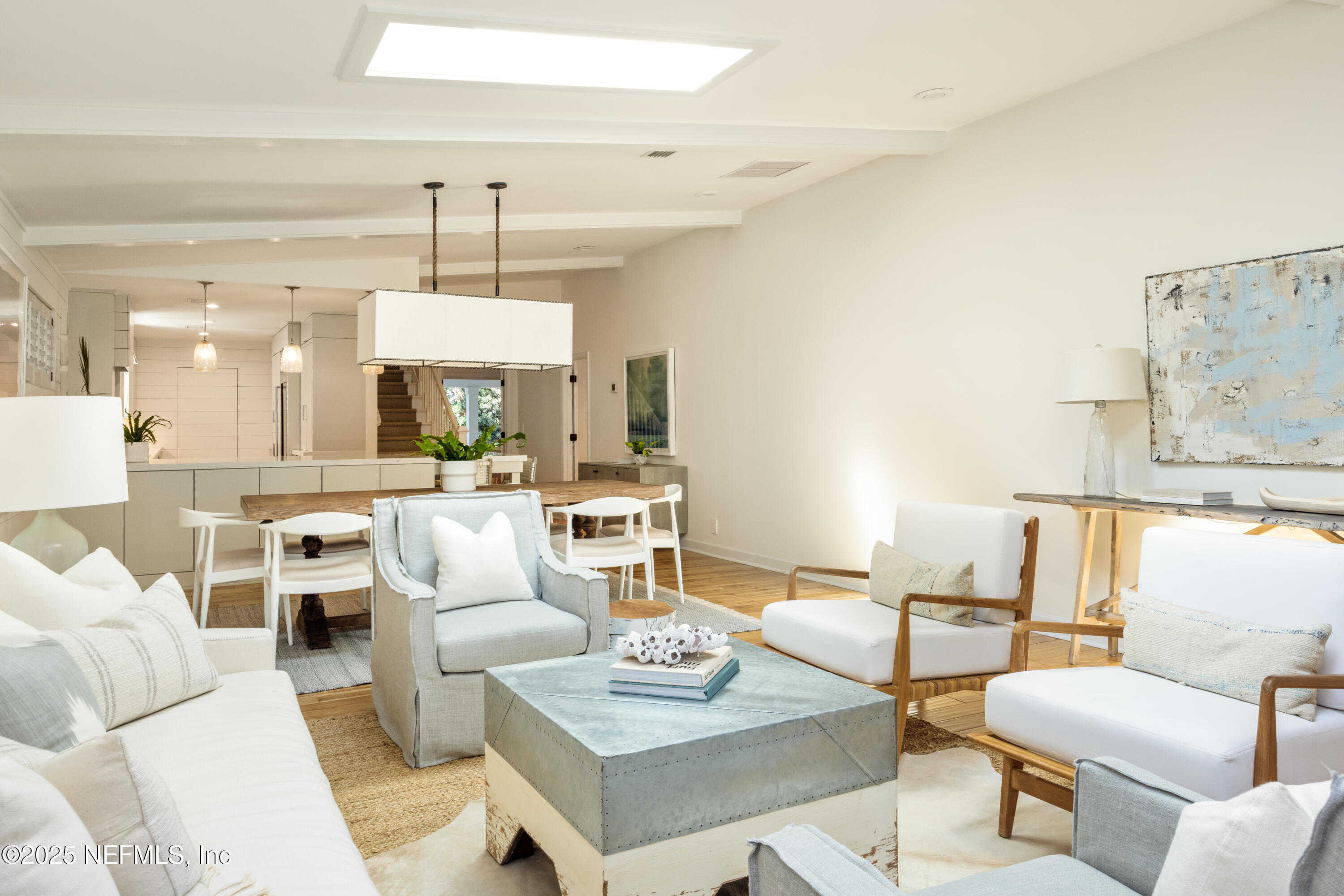 440 Ocean Boulevard Atlantic Beach, FL 32233 - Photo 4 of 34 a living room with furniture kitchen view and a chandelier