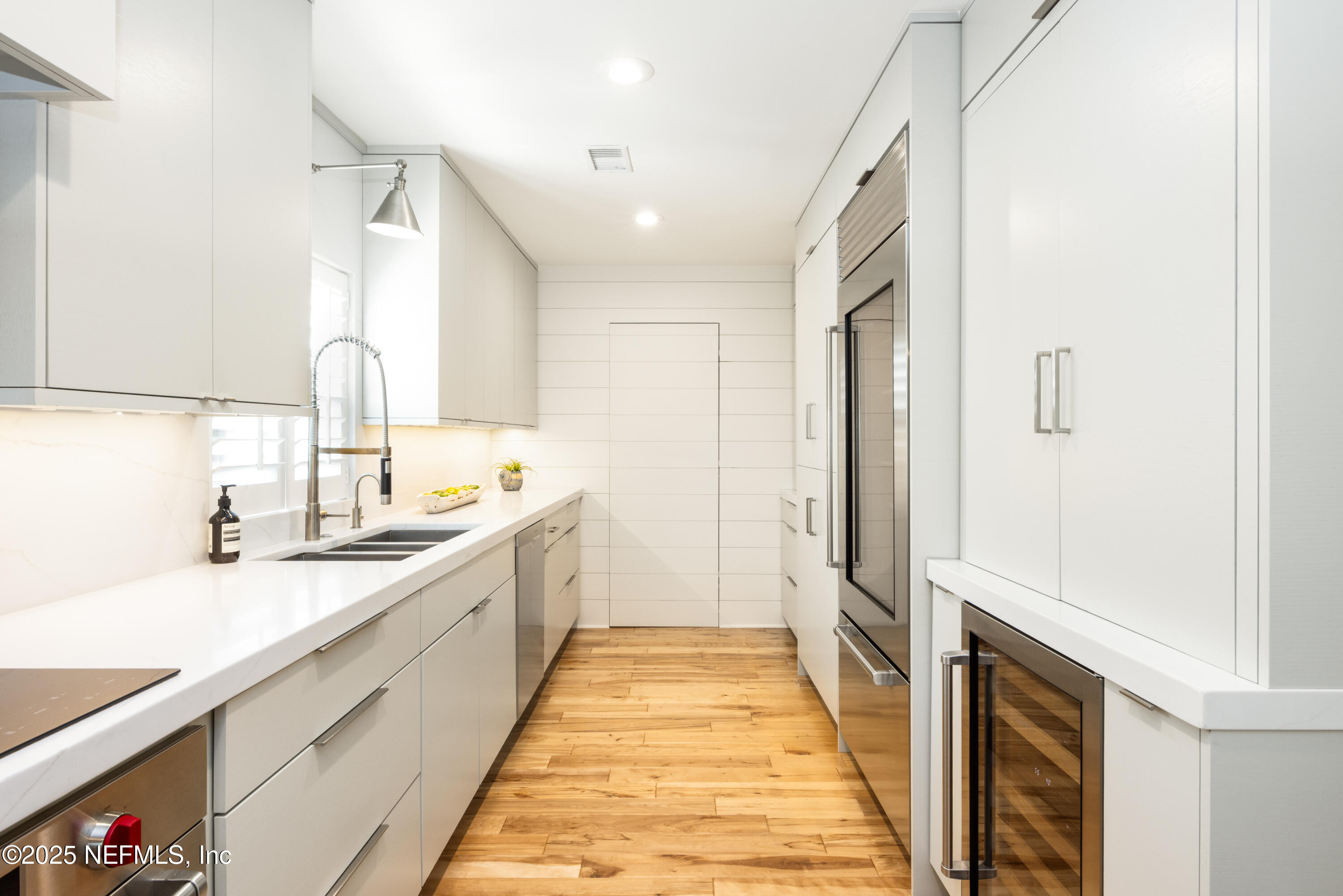 440 Ocean Boulevard Atlantic Beach, FL 32233 - Photo 10 of 34 a bathroom with a double vanity sink and a mirror