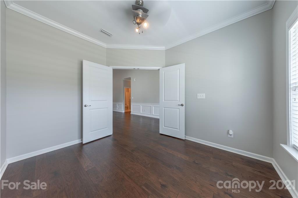 8026 Bryson Road Indian Land, SC 29707 - Photo 11 of 33 wooden floor in an empty room