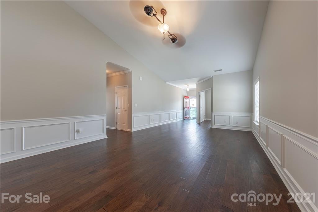 8026 Bryson Road Indian Land, SC 29707 - Photo 12 of 33 a view of a hallway with wooden floor