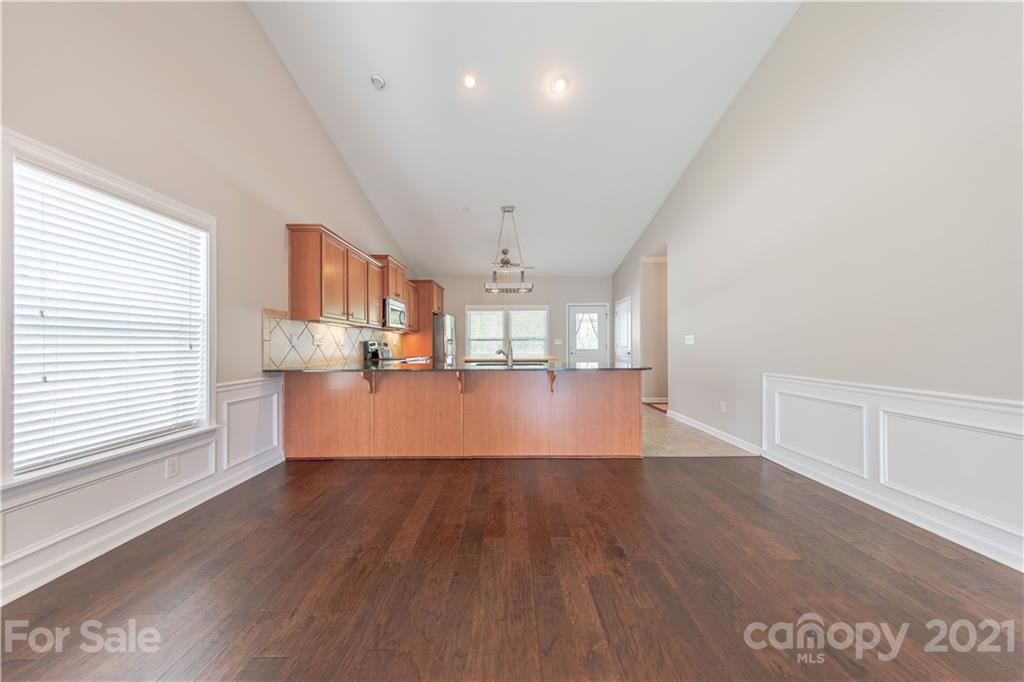 8026 Bryson Road Indian Land, SC 29707 - Photo 14 of 33 a view of a kitchen with wooden floor