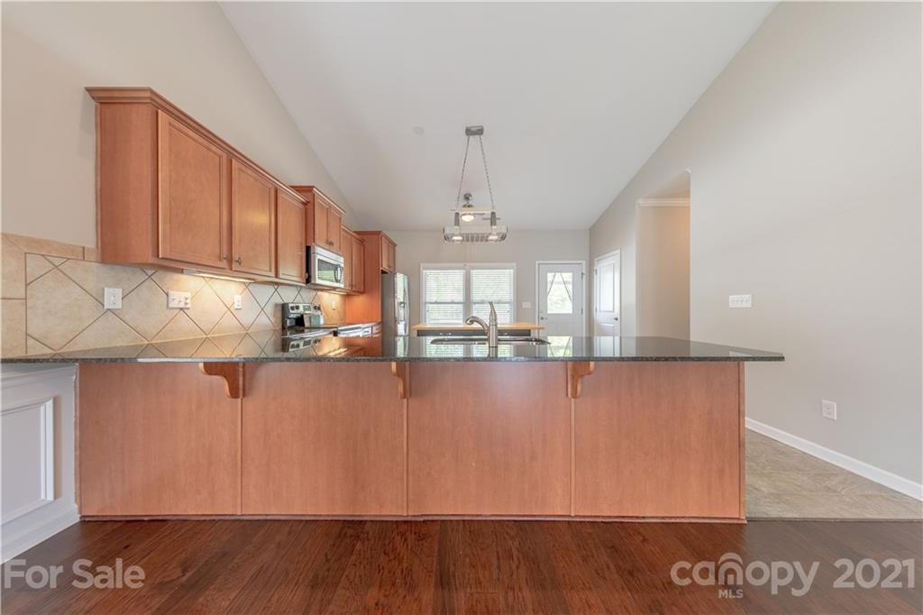 8026 Bryson Road Indian Land, SC 29707 - Photo 15 of 33 a view of a kitchen with wooden floor