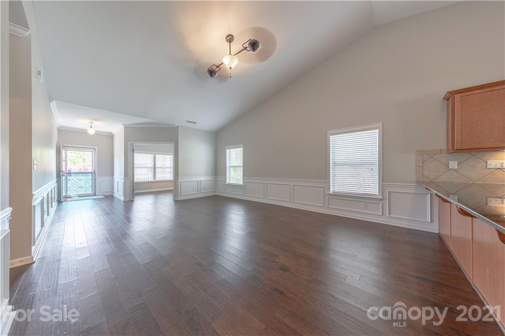 8026 Bryson Road Indian Land, SC 29707 - Photo 16 of 33 a view of an empty room with window and wooden floor