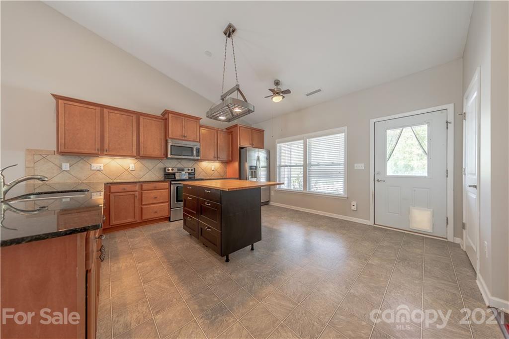 8026 Bryson Road Indian Land, SC 29707 - Photo 18 of 33 a kitchen with a sink cabinets and window