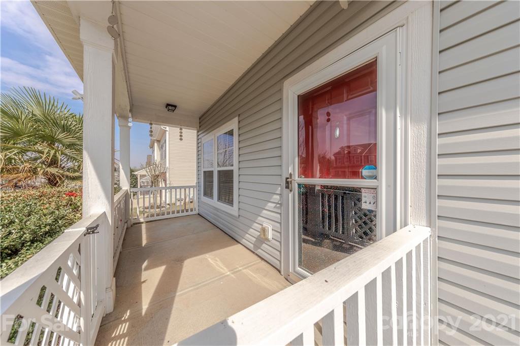 8026 Bryson Road Indian Land, SC 29707 - Photo 4 of 33 a view of a balcony with wooden floor and fence