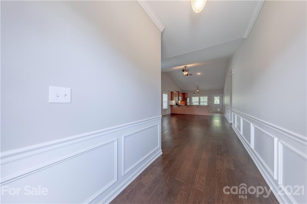 8026 Bryson Road Indian Land, SC 29707 - Photo 6 of 33 a view of a hallway with wooden floor