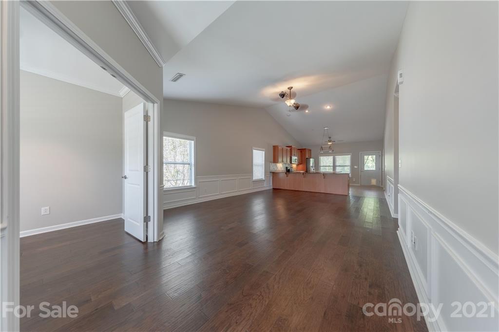 8026 Bryson Road Indian Land, SC 29707 - Photo 7 of 33 a view of a hallway with wooden floor
