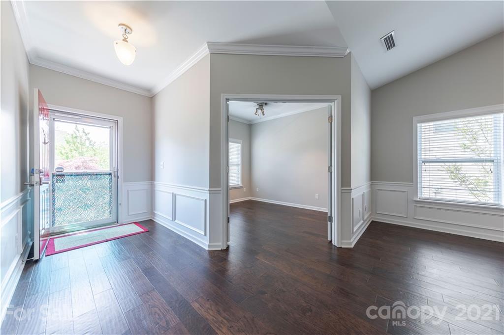 8026 Bryson Road Indian Land, SC 29707 - Photo 8 of 33 wooden floor in an empty room with a window