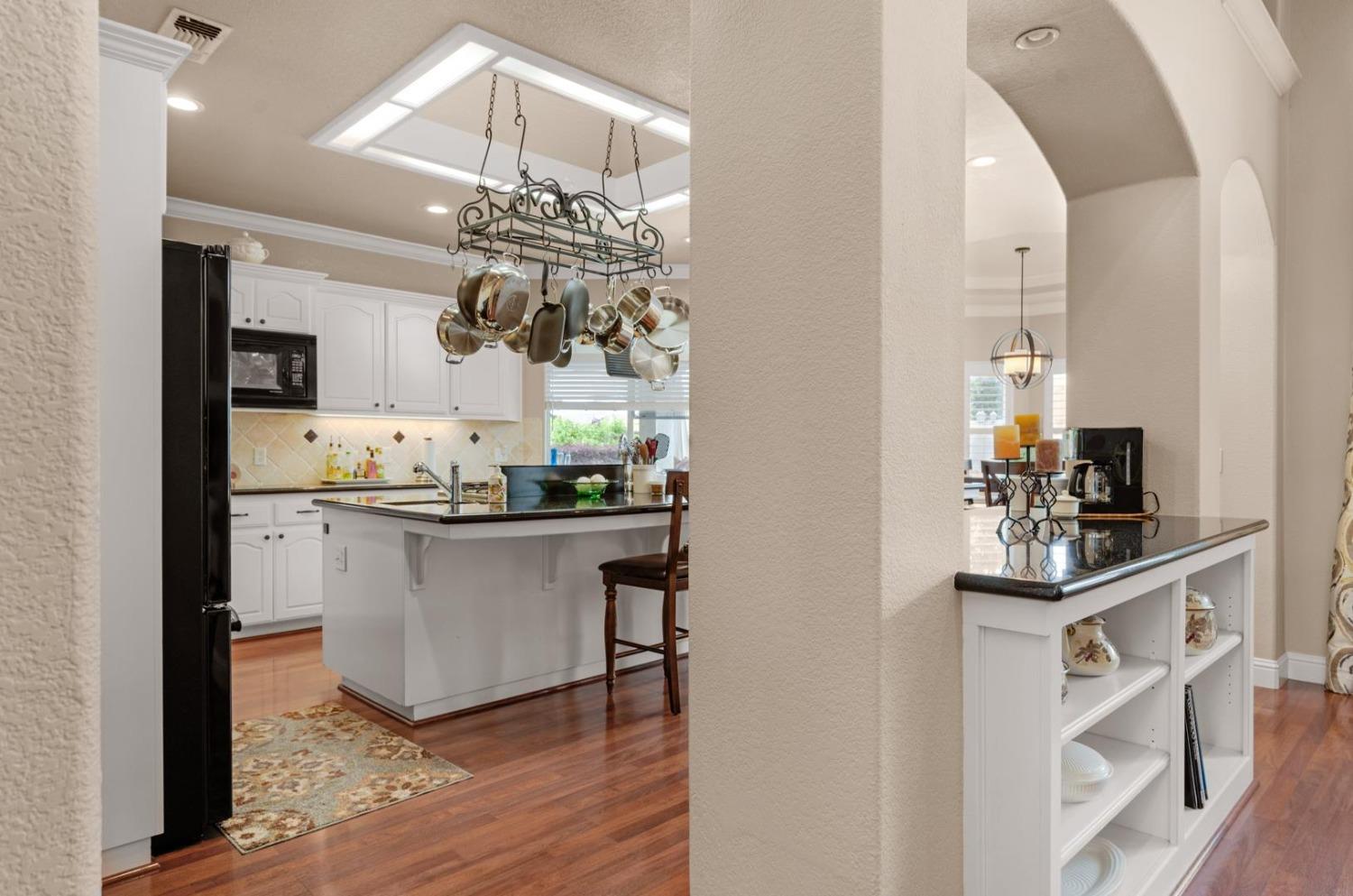 2881 Indianapolis Avenue Clovis, CA 93611 - Photo 13 of 76 a kitchen with stainless steel appliances a sink and cabinets