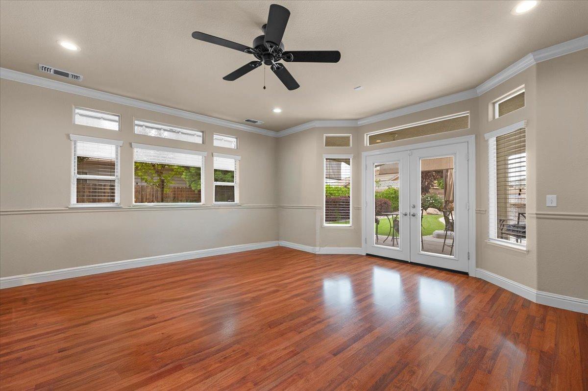 2881 Indianapolis Avenue Clovis, CA 93611 - Photo 47 of 76 a view of an empty room with wooden floor and a window