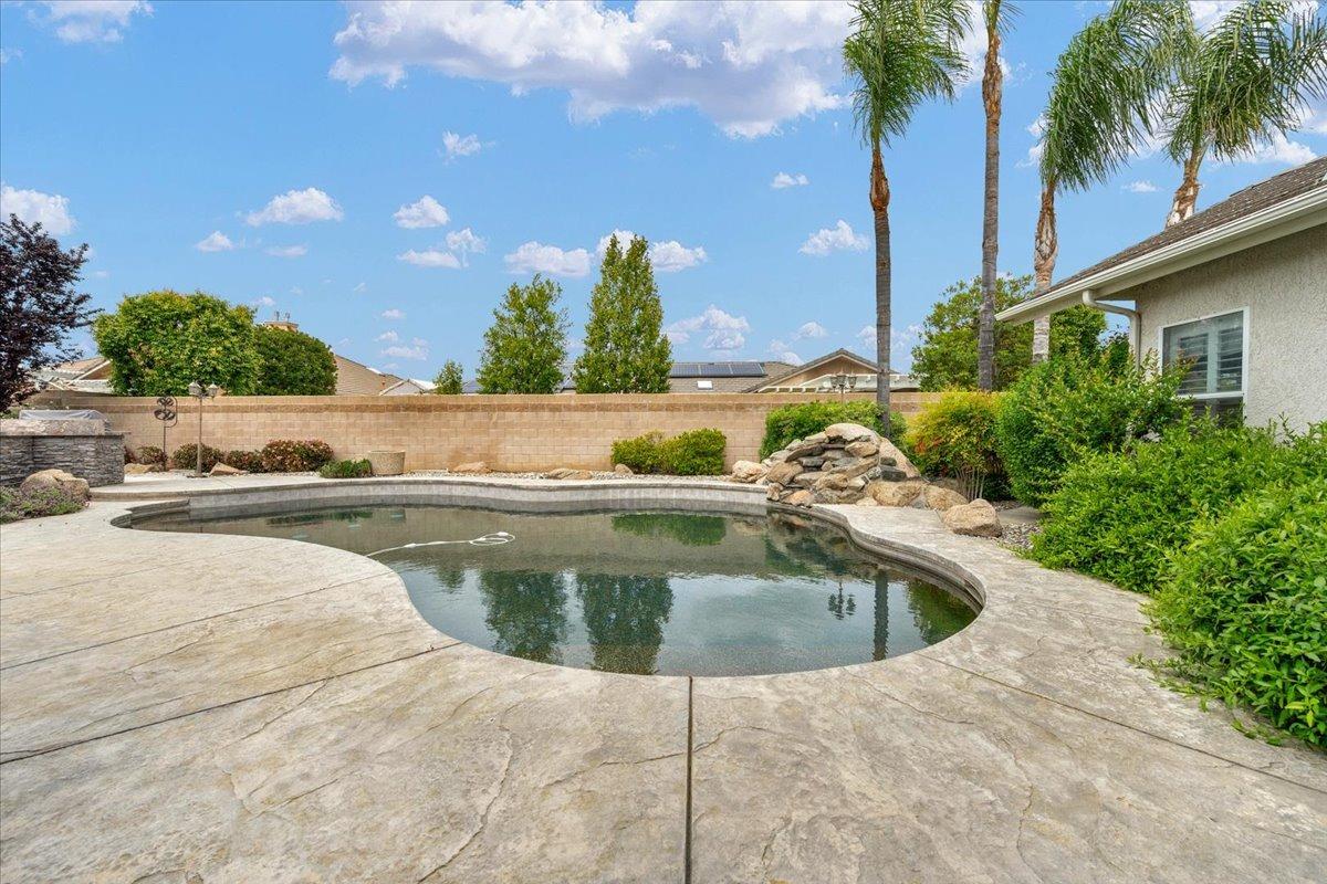 2881 Indianapolis Avenue Clovis, CA 93611 - Photo 59 of 76 a view of swimming pool with outdoor seating and plants