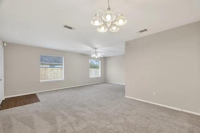 a kitchen with stainless steel appliances a sink stove and cabinets