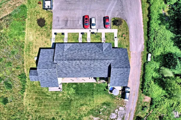 a view of a large body of water with a building in the background