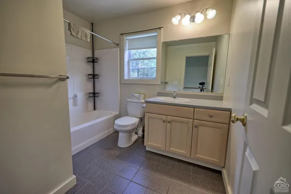 a view of a house with backyard