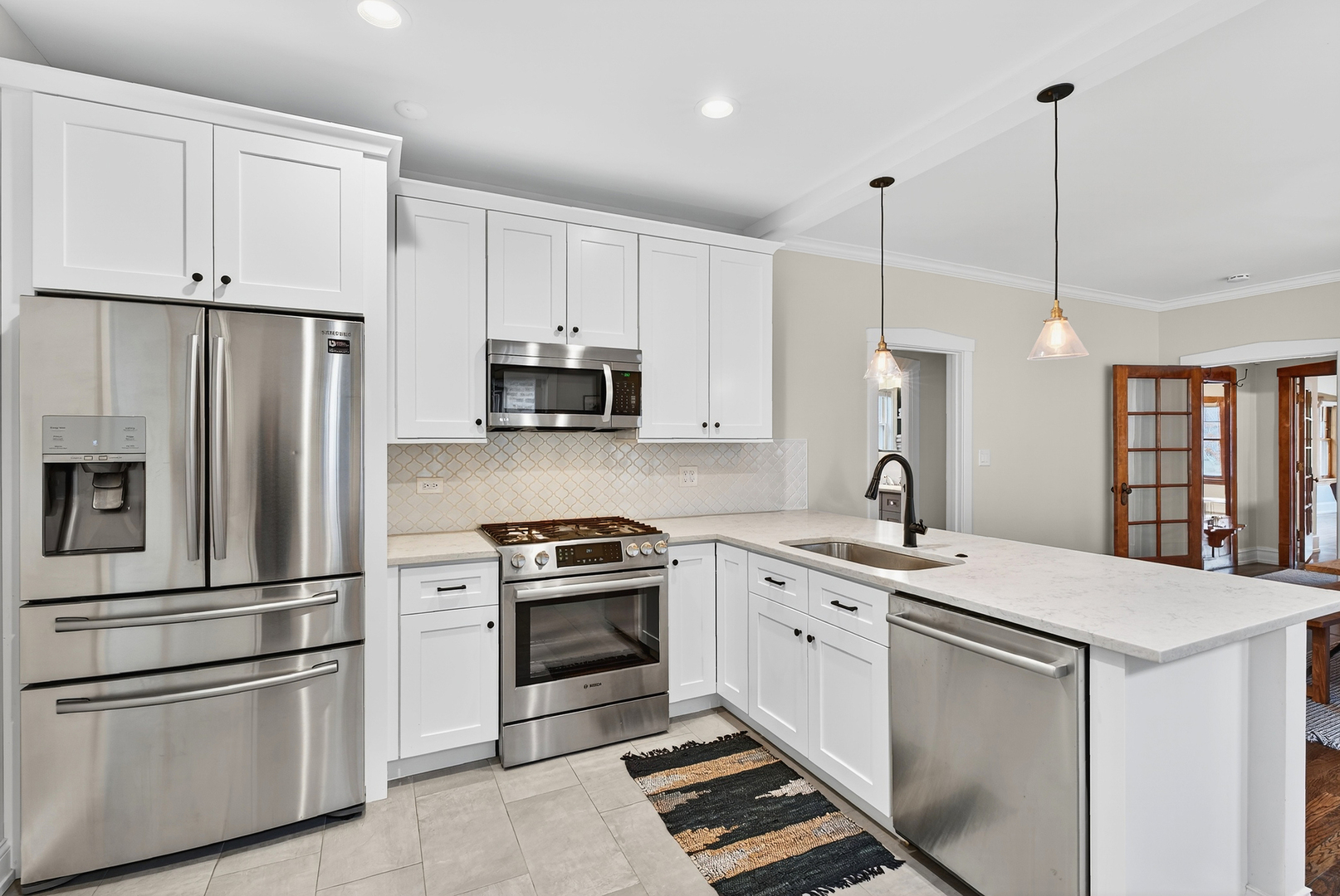 4431 North Richmond Street Chicago, IL 60625 - Photo 13 of 36 a kitchen with stainless steel appliances granite countertop a sink stove and refrigerator