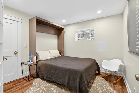 a bedroom with a bed and a table in it