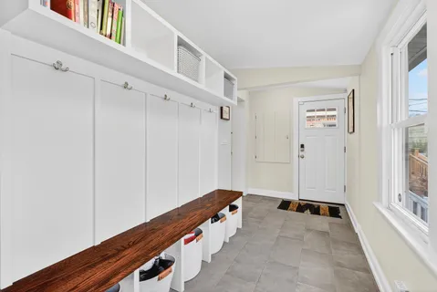 a view of an entryway with wooden floor