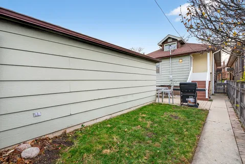 a backyard of a house with seating space