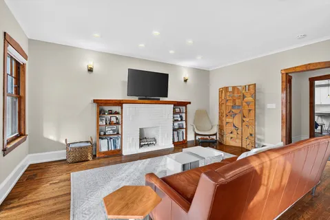 a bedroom with furniture and a flat screen tv