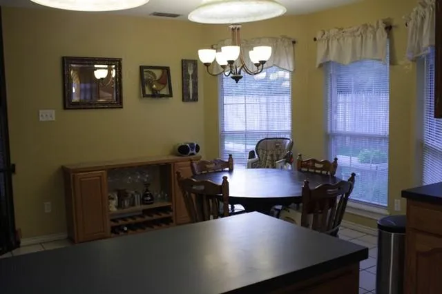 a bedroom with a bed and a dresser in it