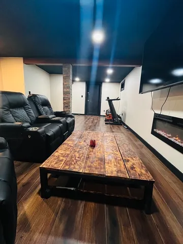 a view of a room with wooden floor