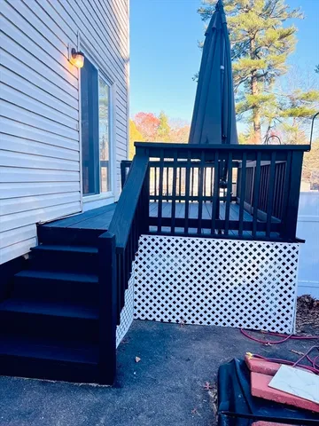 a view of a balcony with wooden floor