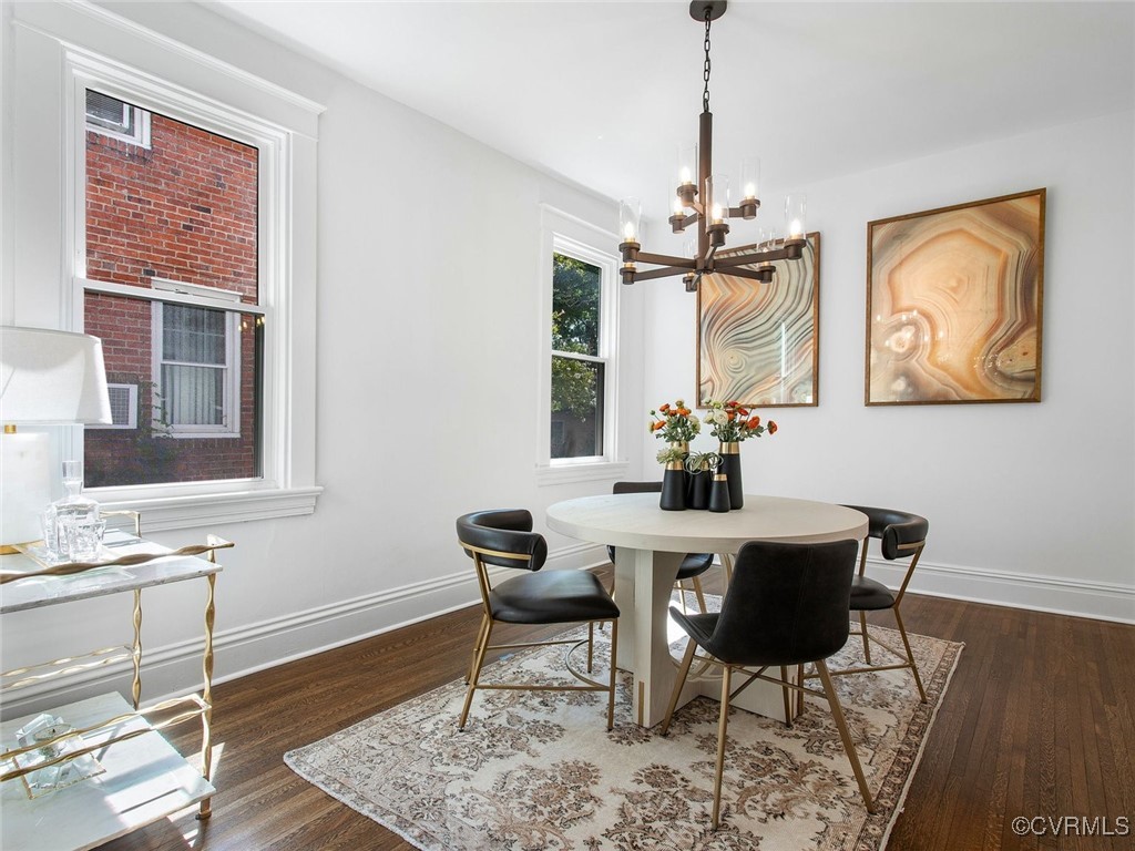 109 Overbrook Road Richmond, VA 23222 - Photo 12 of 47 a dining room with wooden floor and a chandelier