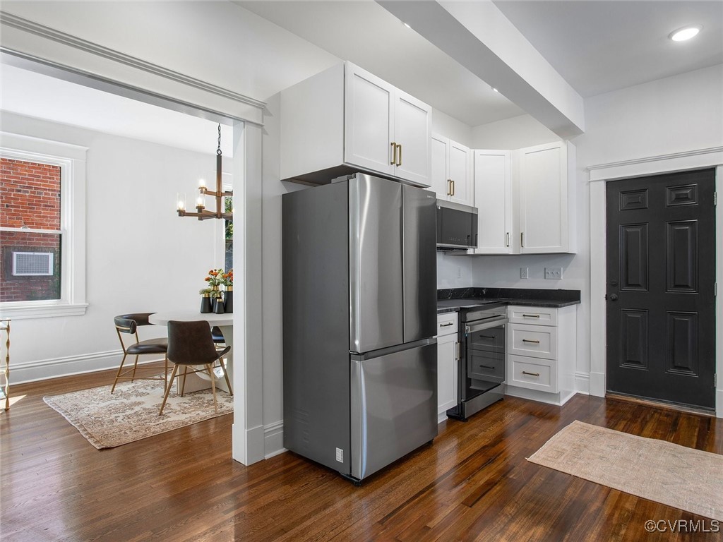 109 Overbrook Road Richmond, VA 23222 - Photo 13 of 47 a kitchen with granite countertop a refrigerator cabinets and wooden floor
