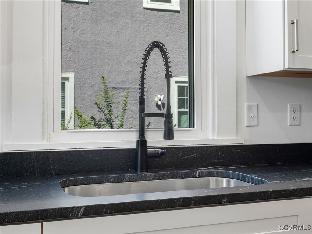 109 Overbrook Road Richmond, VA 23222 - Photo 17 of 47 a bathroom with a sink and a mirror