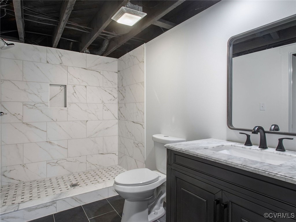 109 Overbrook Road Richmond, VA 23222 - Photo 23 of 47 a bathroom with a granite countertop sink toilet and shower